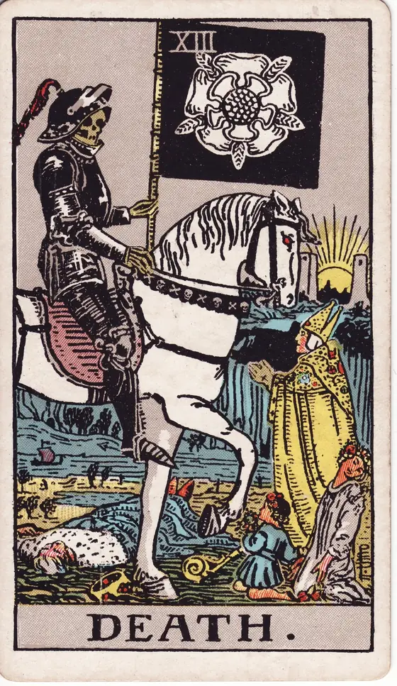 Death tarot card from the Rider-Waite-Smith deck: an armoured skeleton on a white horse carrying a black banner, a bishop and a child standing before him.