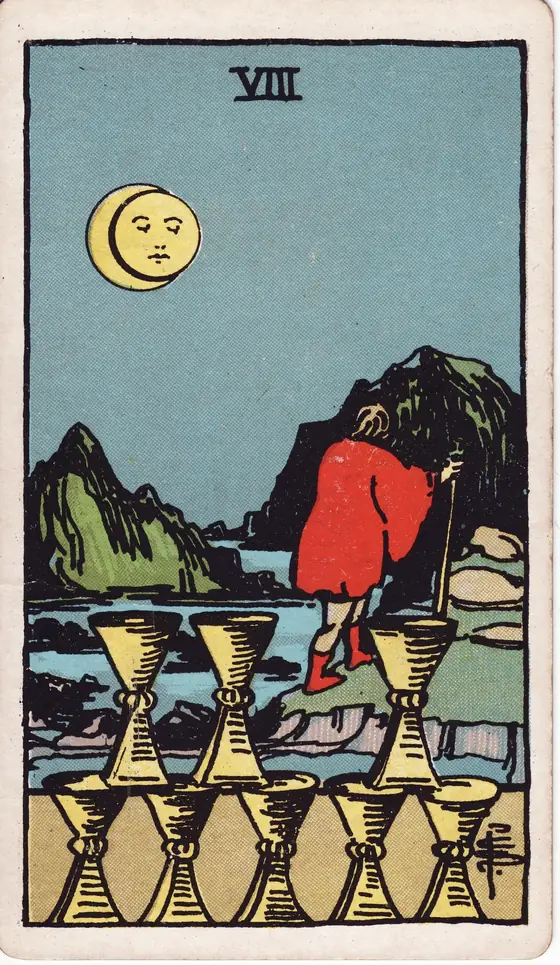 Eight of Cups tarot card from the Rider-Waite-Smith deck: a figure walking away from eight stacked cups toward the mountains under an eclipsed moon.