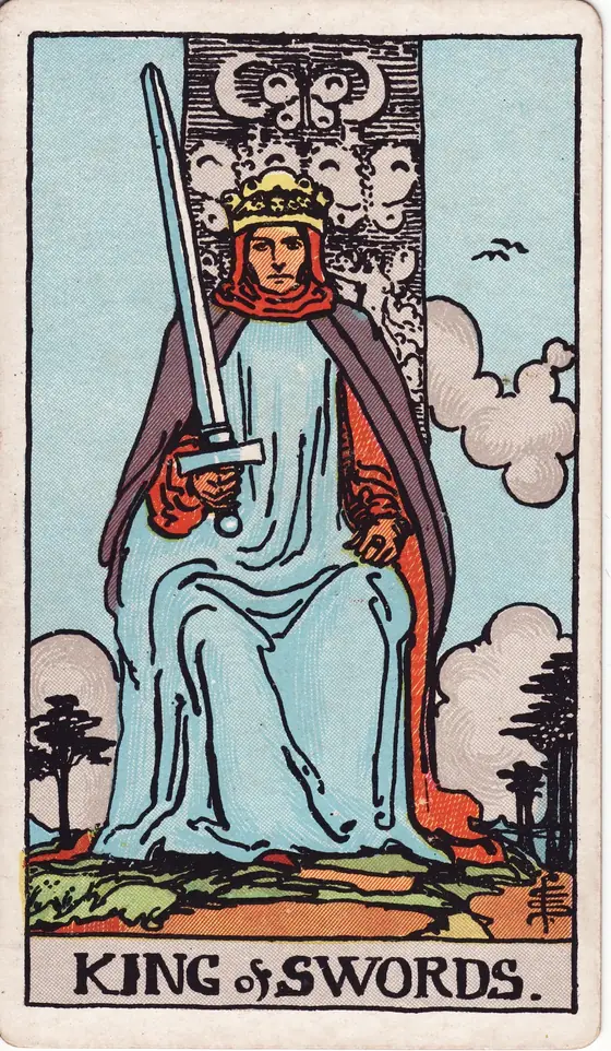 King of Swords tarot card from the Rider-Waite-Smith deck: a king enthroned facing forward, his sword held upright and tilted to one side.