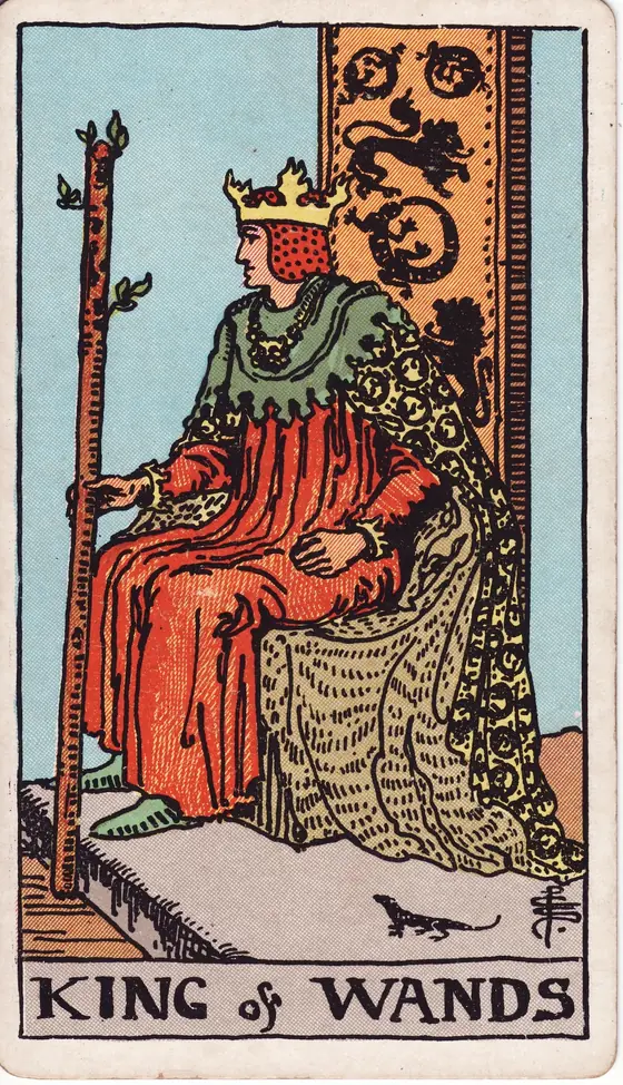 King of Wands tarot card from the Rider-Waite-Smith deck: a crowned king on a throne carved with lions and salamanders, his staff held upright.