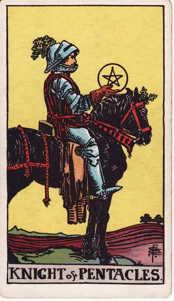 Knight of Pentacles tarot card from the Rider-Waite-Smith deck: an armoured rider on a heavy black horse standing still in a ploughed field.