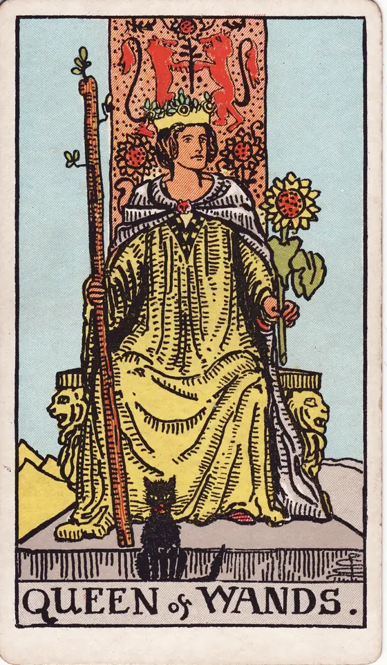 Queen of Wands tarot card from the Rider-Waite-Smith deck: a crowned woman enthroned with a sunflower and a staff, a black cat seated at her feet.