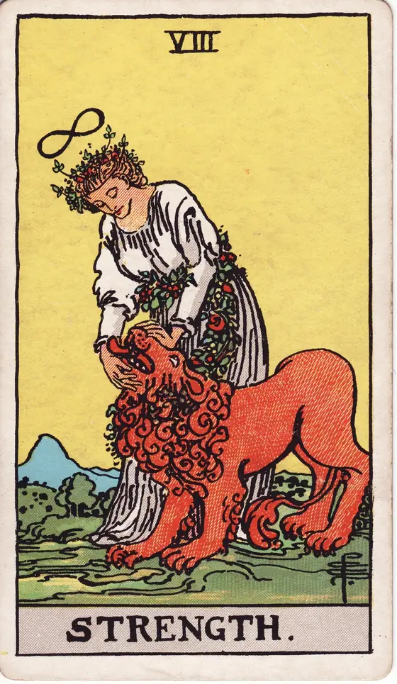 Strength tarot card from the Rider-Waite-Smith deck: a woman in white calmly closing the jaws of a lion, an infinity symbol above her head.