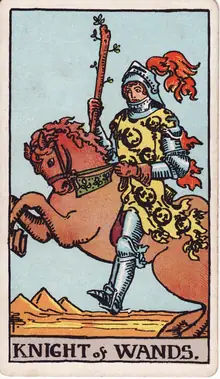 Knight of Wands tarot card from the Rider-Waite-Smith deck: an armoured rider on a rearing horse with his staff raised, pyramids behind him.
