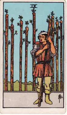Nine of Wands tarot card from the Rider-Waite-Smith deck: a bandaged man leaning on his staff, eight more standing behind him like a fence.