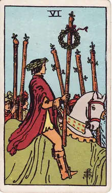 Six of Wands tarot card from the Rider-Waite-Smith deck: a laurel-crowned rider on a white horse carrying a wreathed staff, walkers marching alongside.