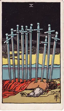 Ten of Swords tarot card from the Rider-Waite-Smith deck: a prone figure at the shore with ten swords in his back under a black sky.