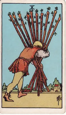 Ten of Wands tarot card from the Rider-Waite-Smith deck: a man bent under the weight of ten staves, carrying them toward a distant town.