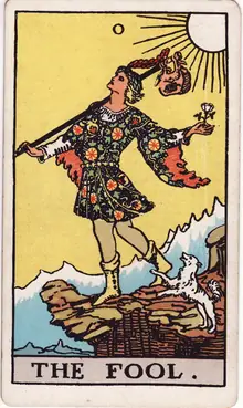 The Fool tarot card from the Rider-Waite-Smith deck: a young traveller stepping off a cliff edge with a white rose in hand and a small dog at his heels.