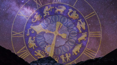 purple & gold clock with all zodiac signs on it - in purple starry sky with mountains